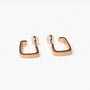 Close up detail of the geometric square band on rose gold clip on hoop earrings