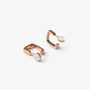 A pair of rose gold huggie square hoop earrings, shown on a clean white background.