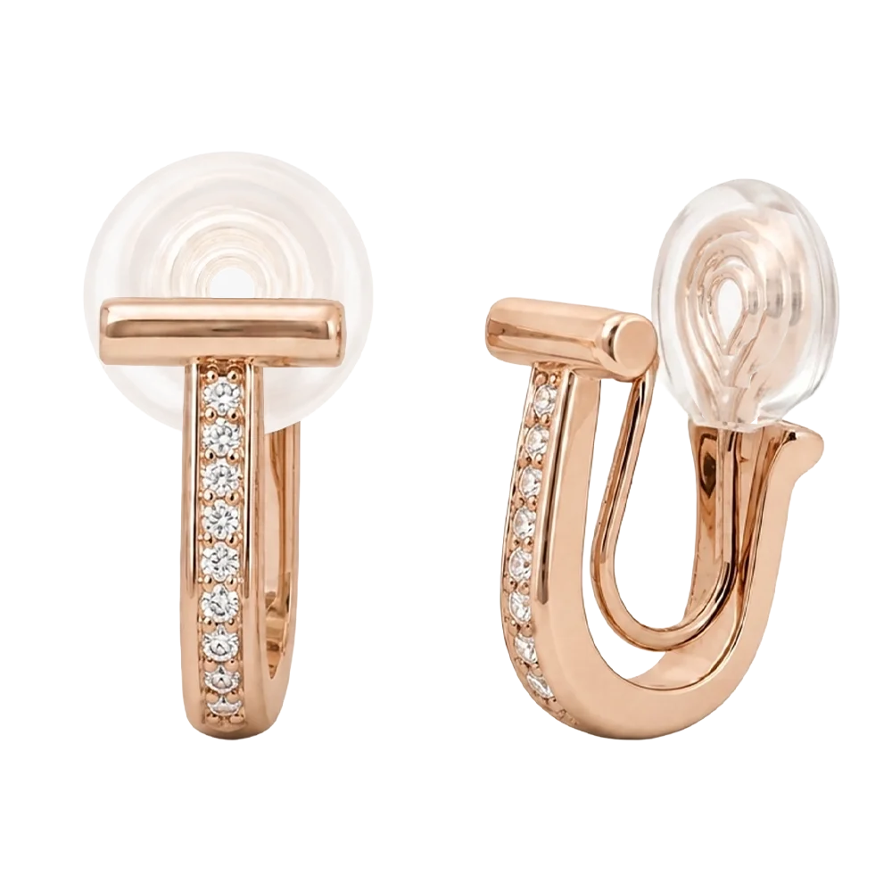 Close-up of rose gold T-motif huggie earrings featuring intricate micro pavé diamond settings on a clean background.