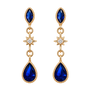 A pair of gold dangle earrings with marquise-cut blue gemstones, a star-shaped clear stone in the middle, and pear-shaped blue gemstones at the bottom