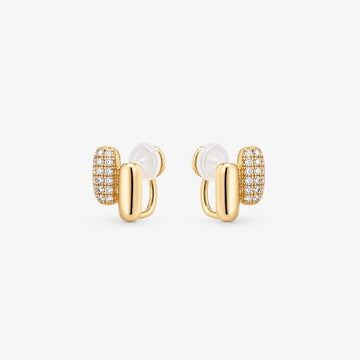 Front view of elongated pill-shaped rose gold huggie earrings with shining pavé cubic zirconia accents on a white background.