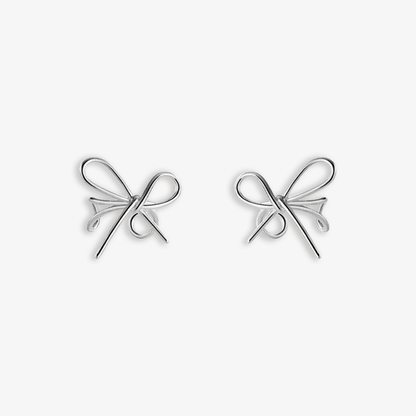 Sleek silver Chic Bow Conch Ear Cuffs made from S925 silver, embodying a minimalist and modern charm. Ideal for versatile styling, they provide an effortlessly chic addition to any look, suitable for both casual and formal events.