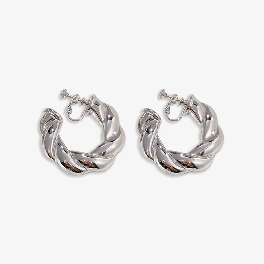 Silver alloy Bold Twist Hoop Clip On Earrings offer a fusion of timeless elegance and contemporary design. Their lustrous silver finish and unique twist pattern, paired with a comfortable screw-back clip-on, add a modern flair to traditional hoop earrings.