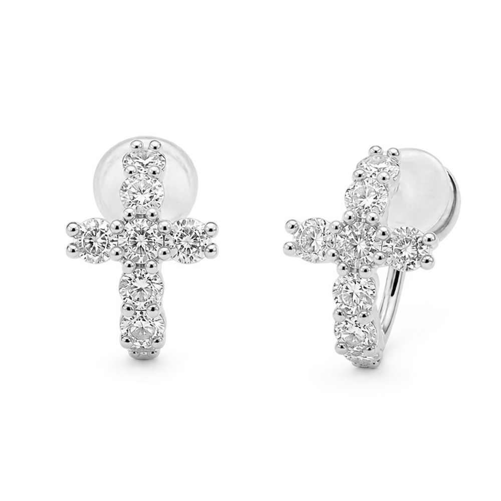 A pair of silver hoop earrings with a cross-shaped front adorned with clear cubic zirconia stones, shown on a plain white background.