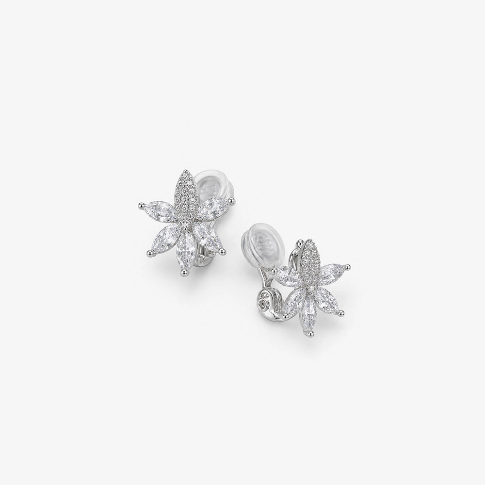 Angled view of silver crystal flower clip on earrings for non pierced ears