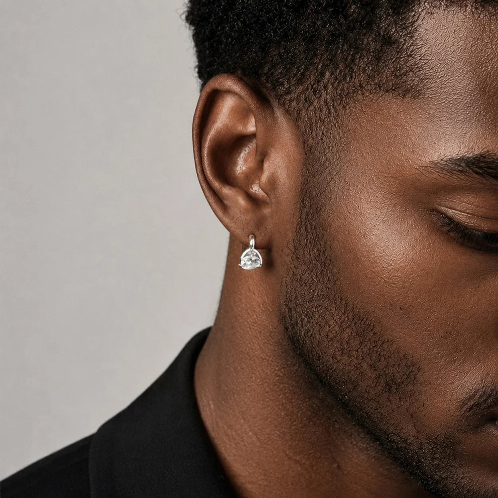 Man wearing a silver CZ solitaire clip on stud earring on a non pierced ear