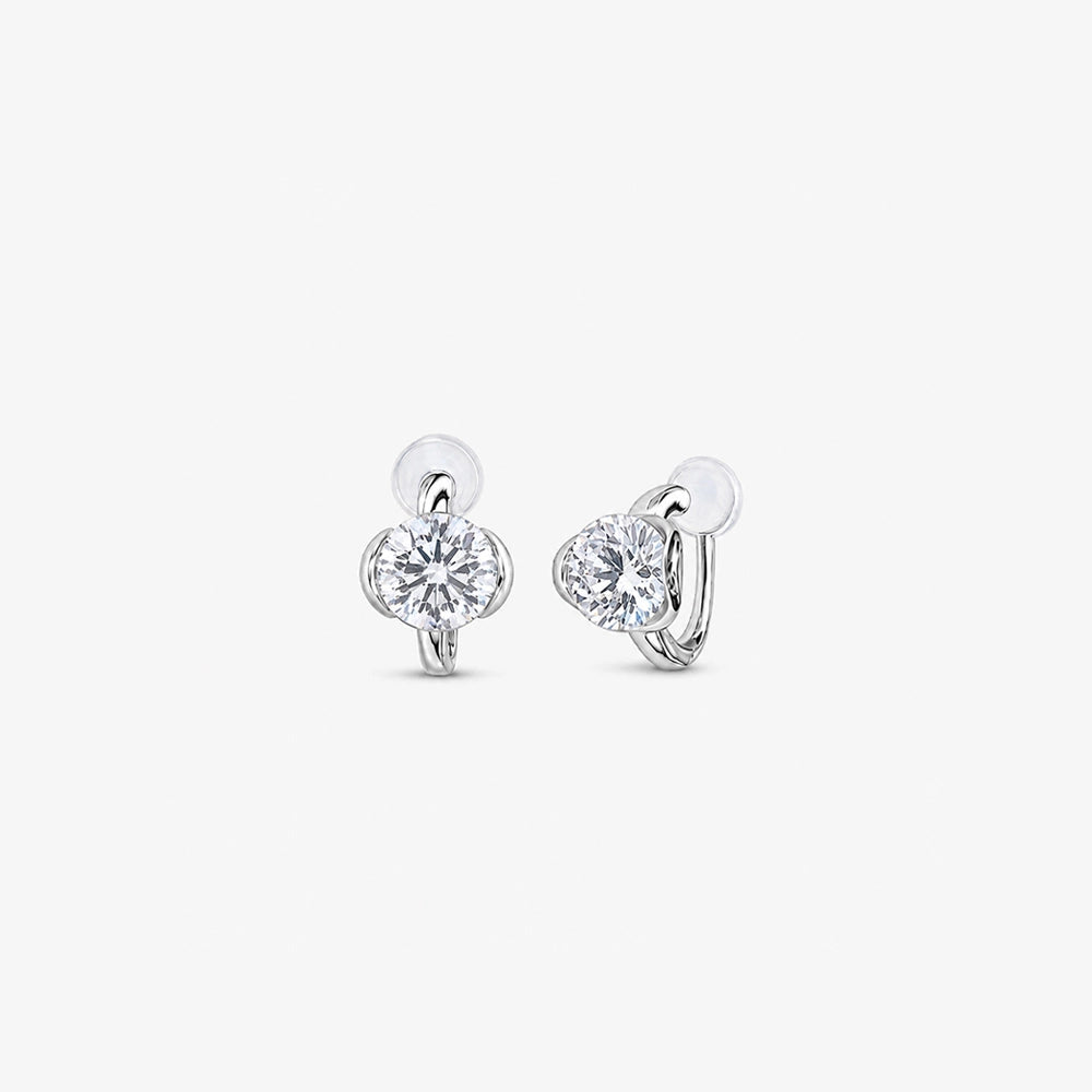 Pair of silver cubic zirconia solitaire clip on stud earrings shown from the front
