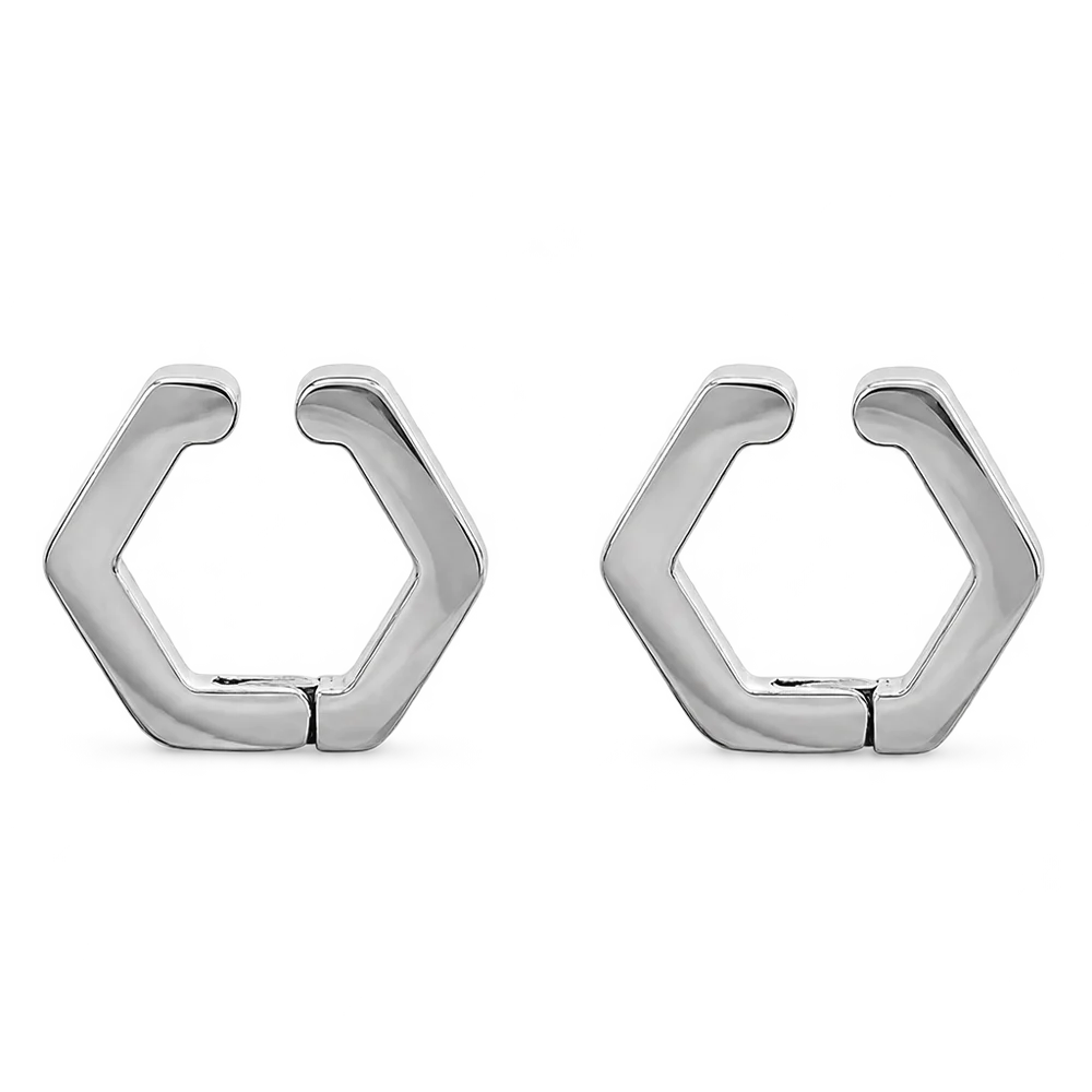 A pair of silver-toned geometric huggie hoop earrings with a hexagonal design, shown on a plain white background.