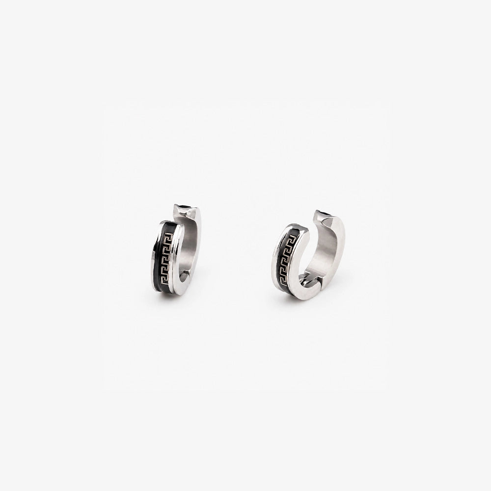 Angled view of unisex silver greek key clip on huggie earrings for non pierced ears