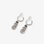 Silver grey disc drop clip on earrings showing the cushioned clip on hoop