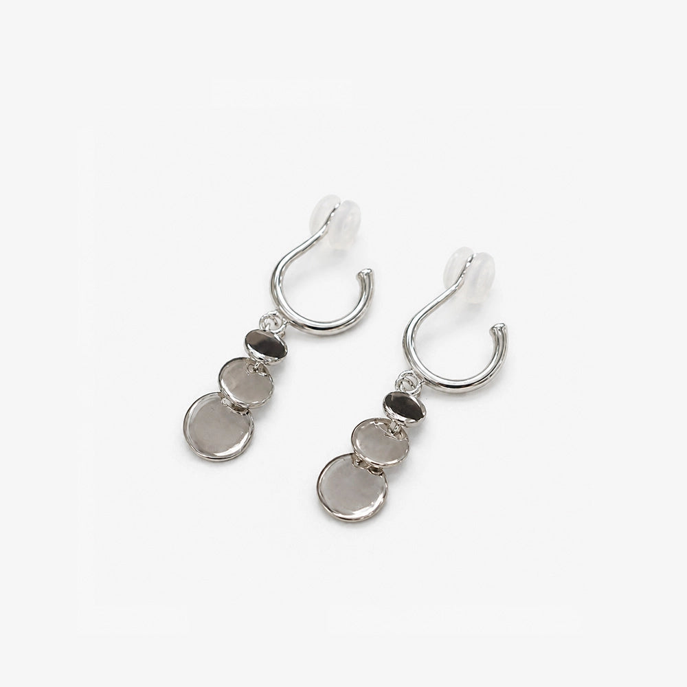 Silver grey disc drop clip on earrings showing the cushioned clip on hoop