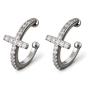 A pair of silver-toned huggie hoop earrings with a central cross design, both adorned with clear pavé stones. 