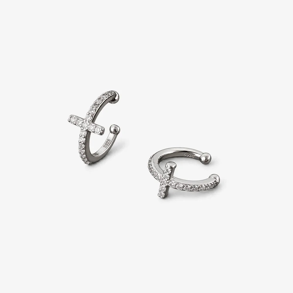 A minimalist, polished silver band ring with a flat, brushed finish on the top half and a beveled edge on the bottom, shown against a plain white background.