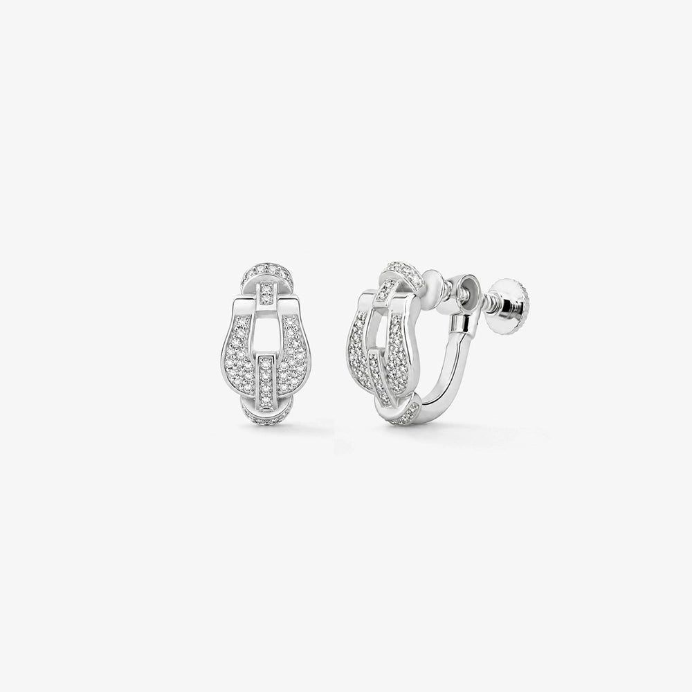 a pair of Silver Pave Horseshoe Clip On Earrings against a white background, highlighting the sparkling pave stones and the clip-on mechanism.