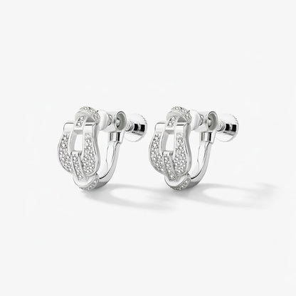 A studio shot of a pair of Silver Pave Horseshoe Clip On Earrings against a white background, highlighting the sparkling pave stones and the clip-on mechanism.