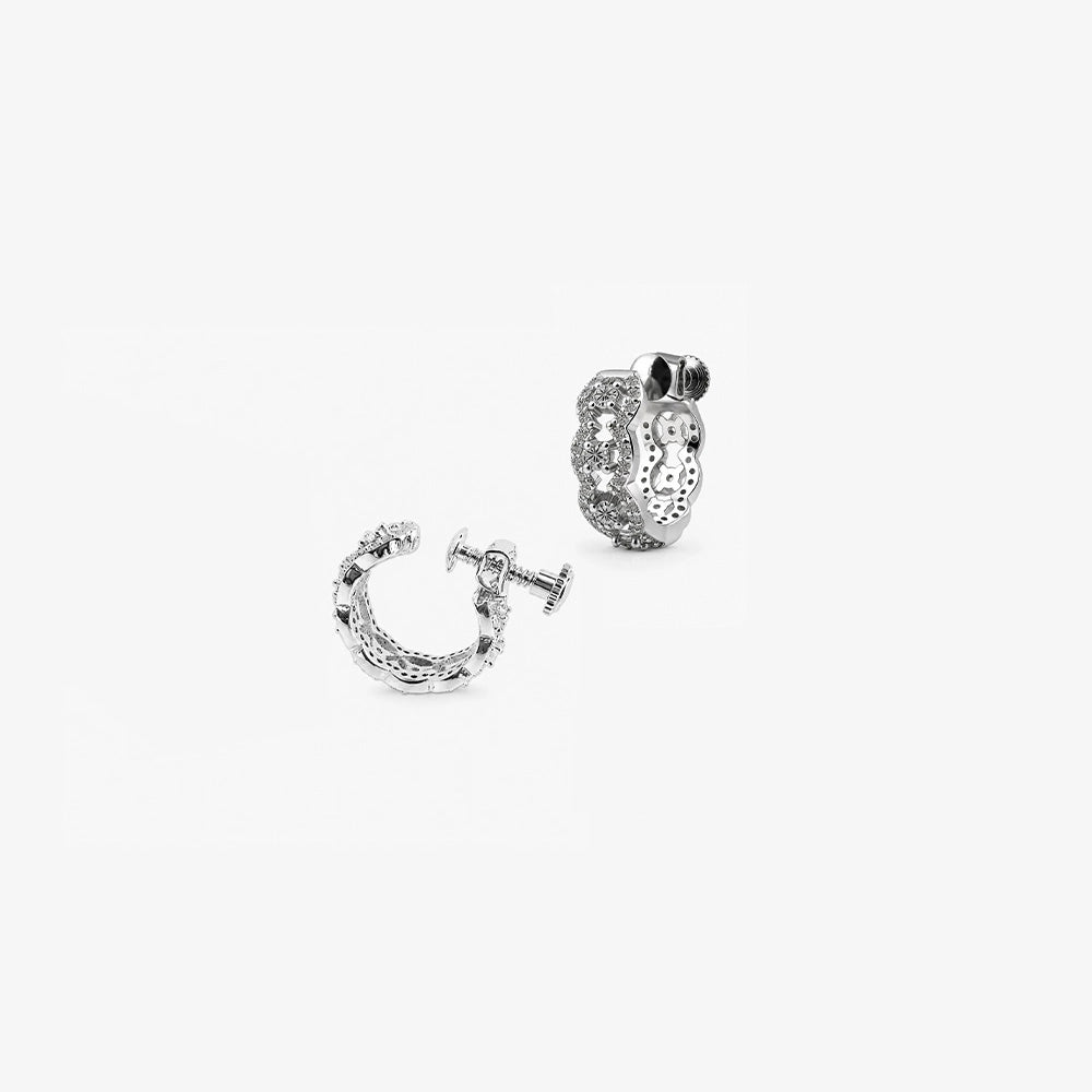 A detailed view of the silver pavé clip-on hoop earring with moissanite stones, showing the intricate wave pattern and adjustable screw-back.