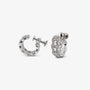 A pair of silver huggie hoop earrings adorned with clear pavé-set crystals, shown from both the front and side angles on a light gray background.