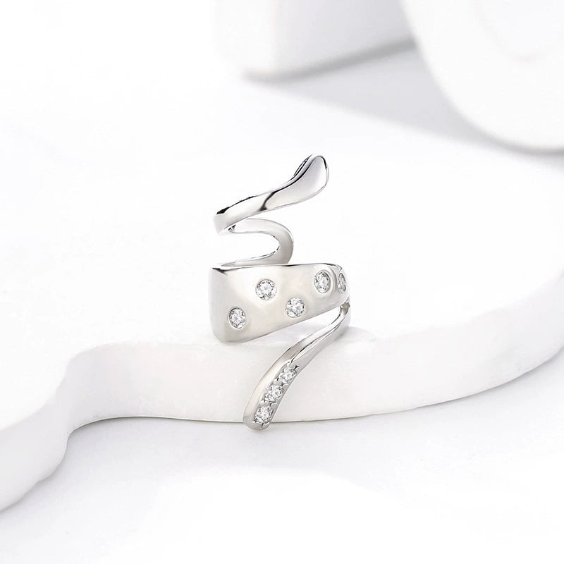 Silver Snake Ear Cuff with Zirconia Accents displayed on white stand, angled view
