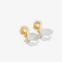 Front view of gold solitaire drop clip-on studs on a light gray background