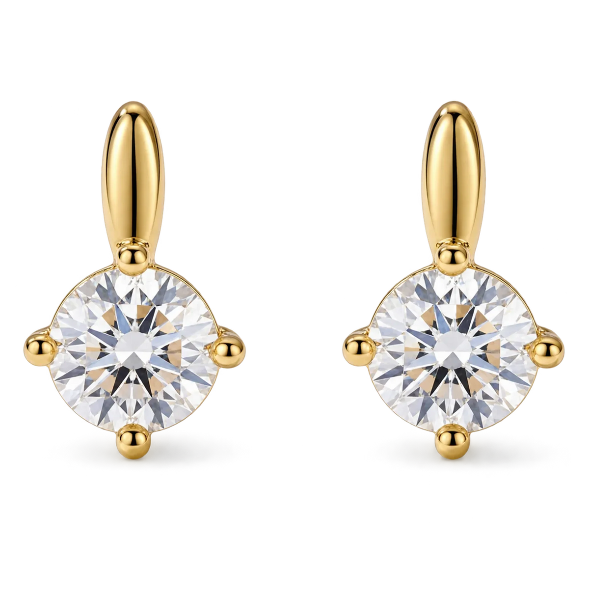 Pair of gold solitaire drop clip-on stud earrings with round cubic zirconia