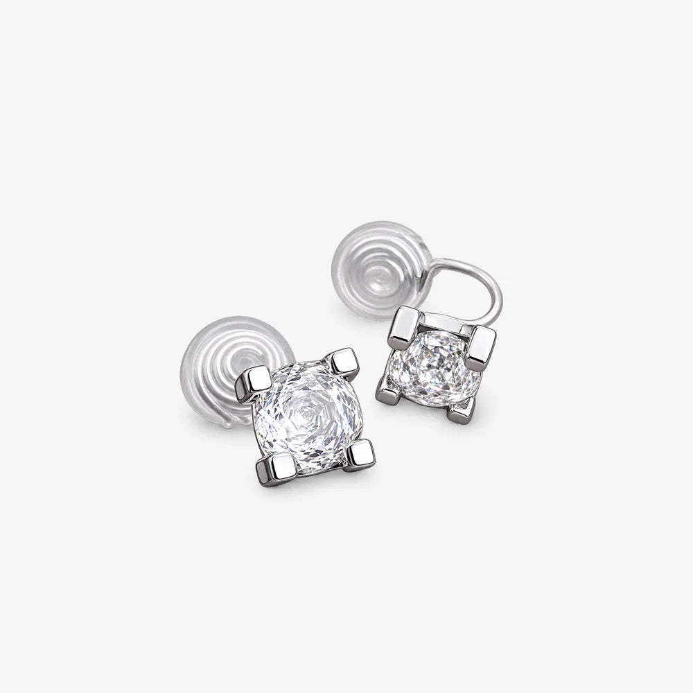 Front view of square-cut cubic zirconia clip-on studs on a light gray background