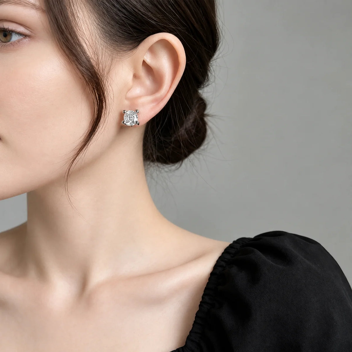 Square CZ clip-on stud worn on a non-pierced earlobe