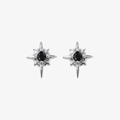 A pair of Starlight Obsidian magnetic stud earrings, featuring a multi-pointed star design with a black cubic zirconia center, isolated on a white background.