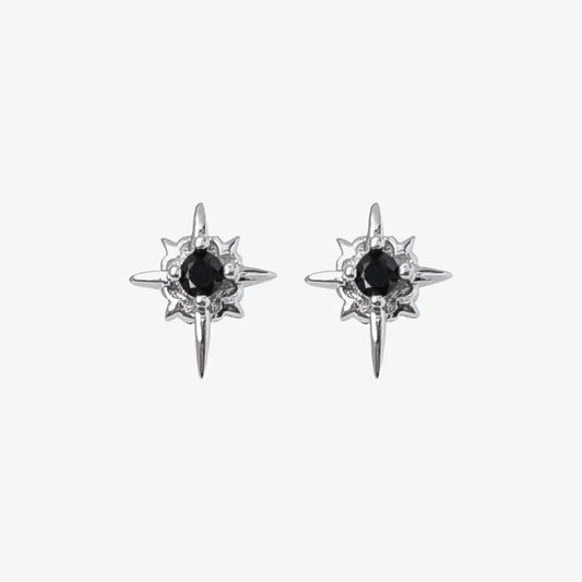 A pair of Starlight Obsidian magnetic stud earrings, featuring a multi-pointed star design with a black cubic zirconia center, isolated on a white background.