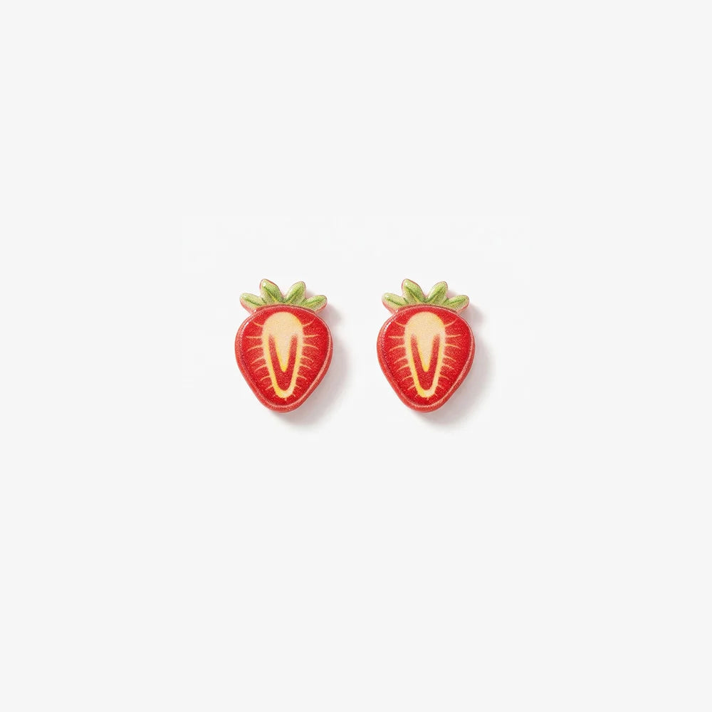 Pair of realistic 3D strawberry slice magnetic clip-on earrings with vibrant red and white resin detailing on a soft background.