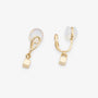 Close-up of the twisted gold wire loop and cube charm on C-Type clip-on earrings
