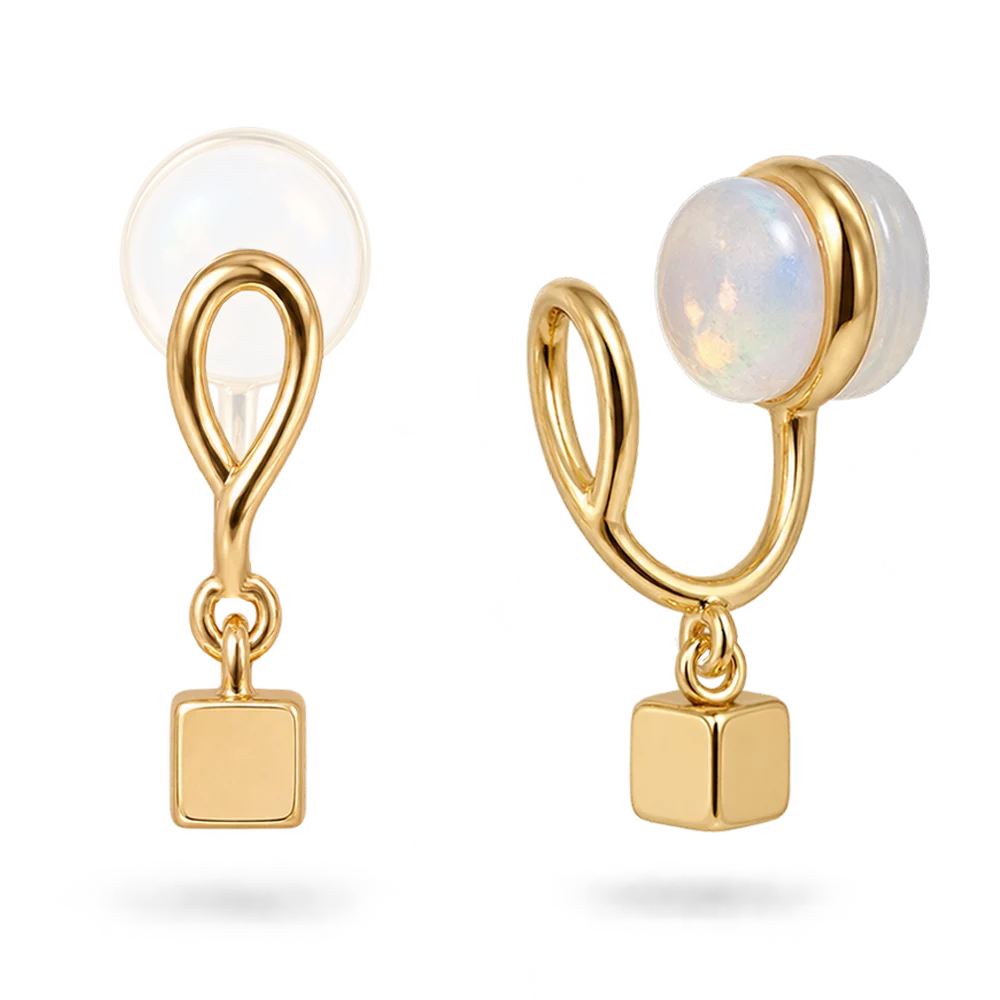 Pair of dainty gold cube charm clip-on earrings on sculpted clips with clear resin pads