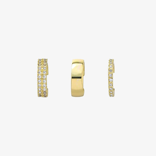The complete trio gold ear cuff set, showing a double pavé, a wide band, and a single pavé cuff, lined up on a white background.
