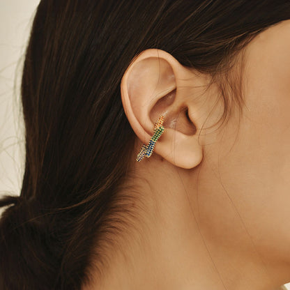 Woman wearing clip-on conch cuff earring with a star design, ideal for non-pierced ears. A  bold and celestial statement.