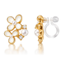 A pair of gold hoop earrings with white pearl flower motifs and small clear crystal accents, shown on a clean white background with one earring facing forward and the other angled to show the post and clear elastic clip on back.