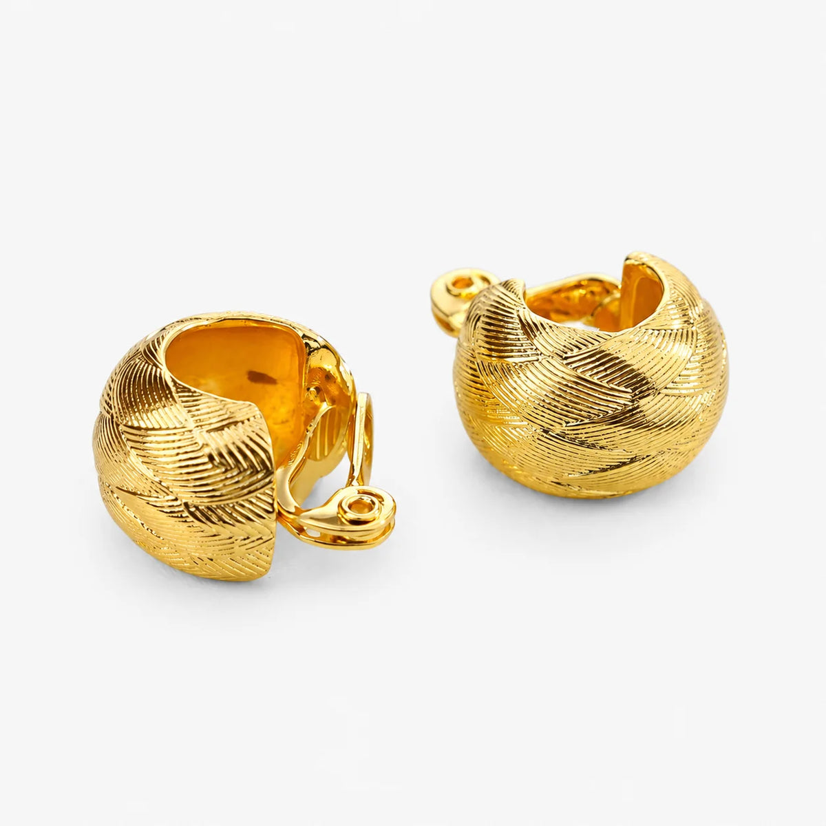 Woven gold dome hoop clip-on earrings showing the adjustable hinged clip inside the hoop