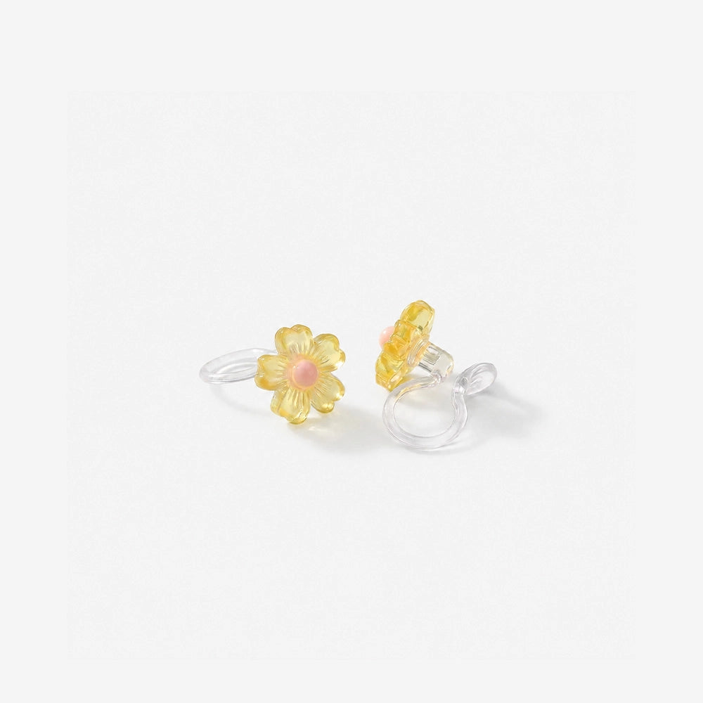 Pair of honey yellow daisy candy color earrings with a translucent jelly finish and pink centers.