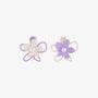 Pastel Petals Mismatched Clip-On Earrings in purple and cream with pearl centers, front view on white background