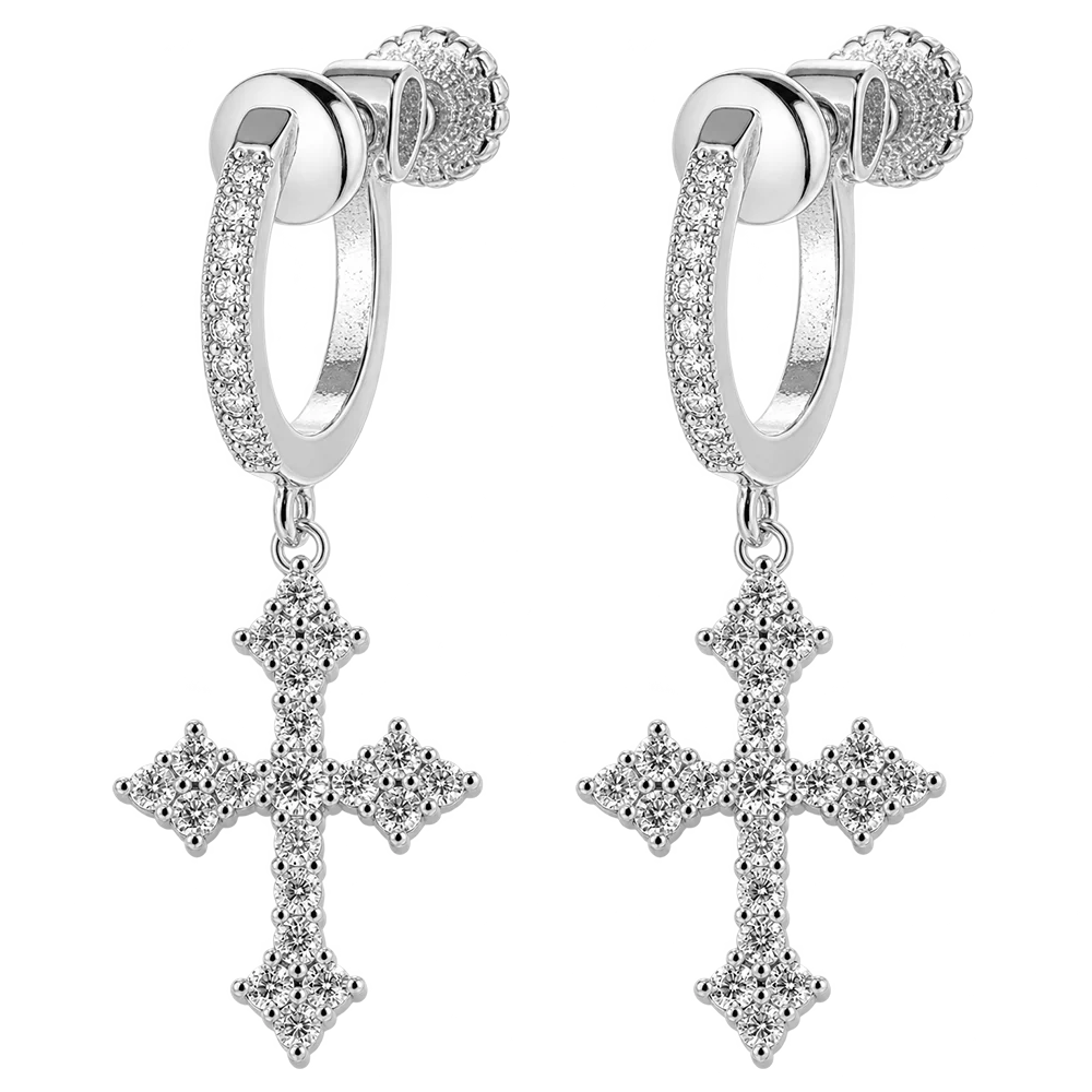 A pair of silver hoop earrings with small clear stones along the front and a dangling cross-shaped cross adorned with clear stones, shown on a plain white background.