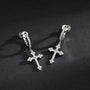 Showcase of Zirconia Cross Clip On Earrings with zirconia stones.